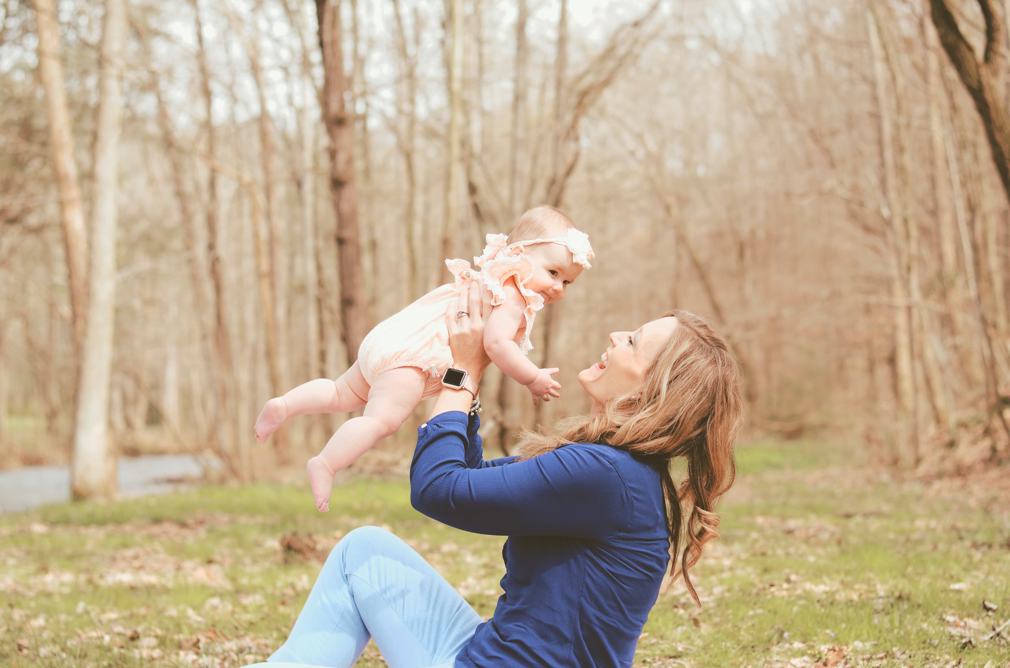 A woman playing a child 