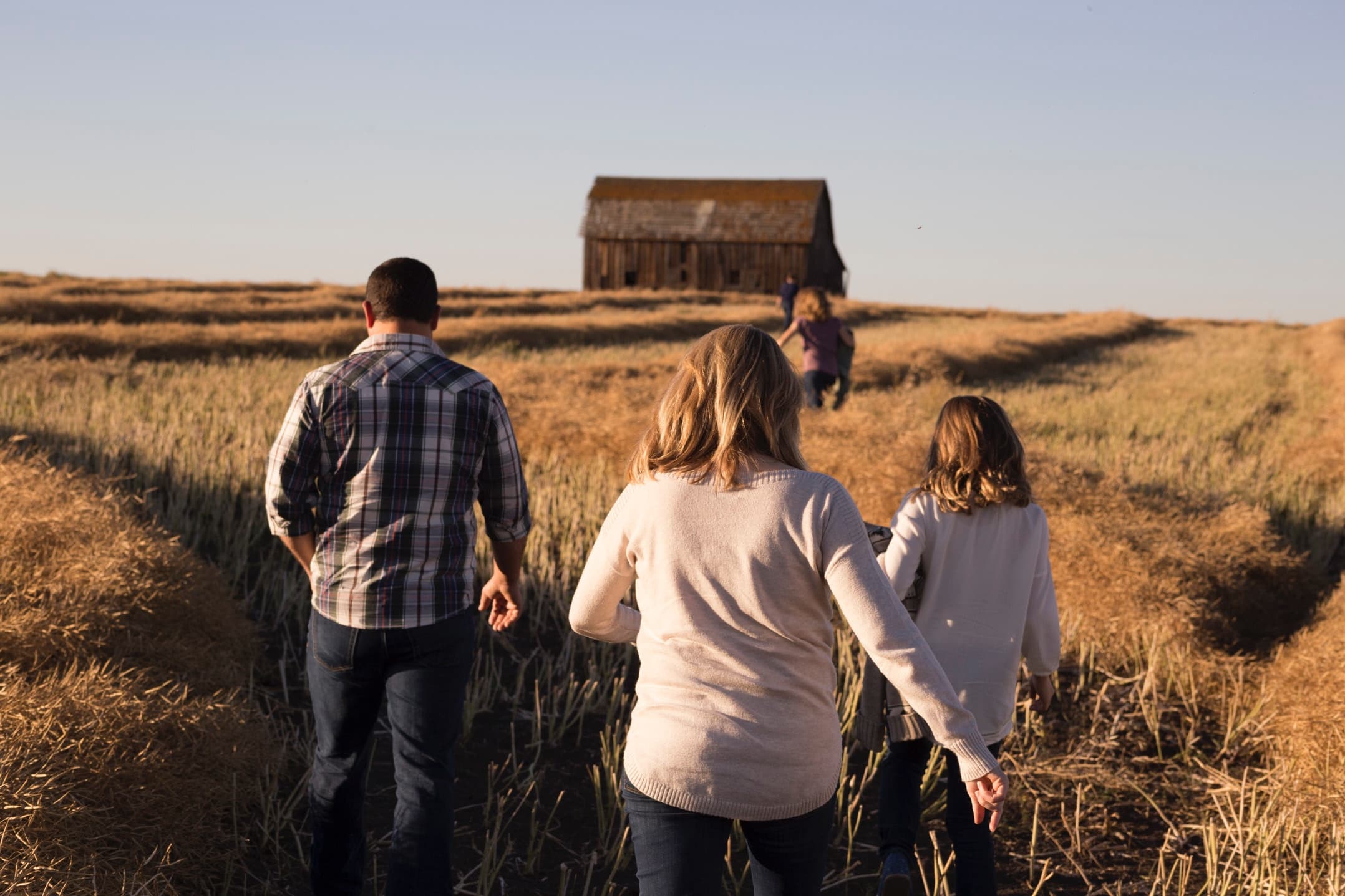 A family walking through a field