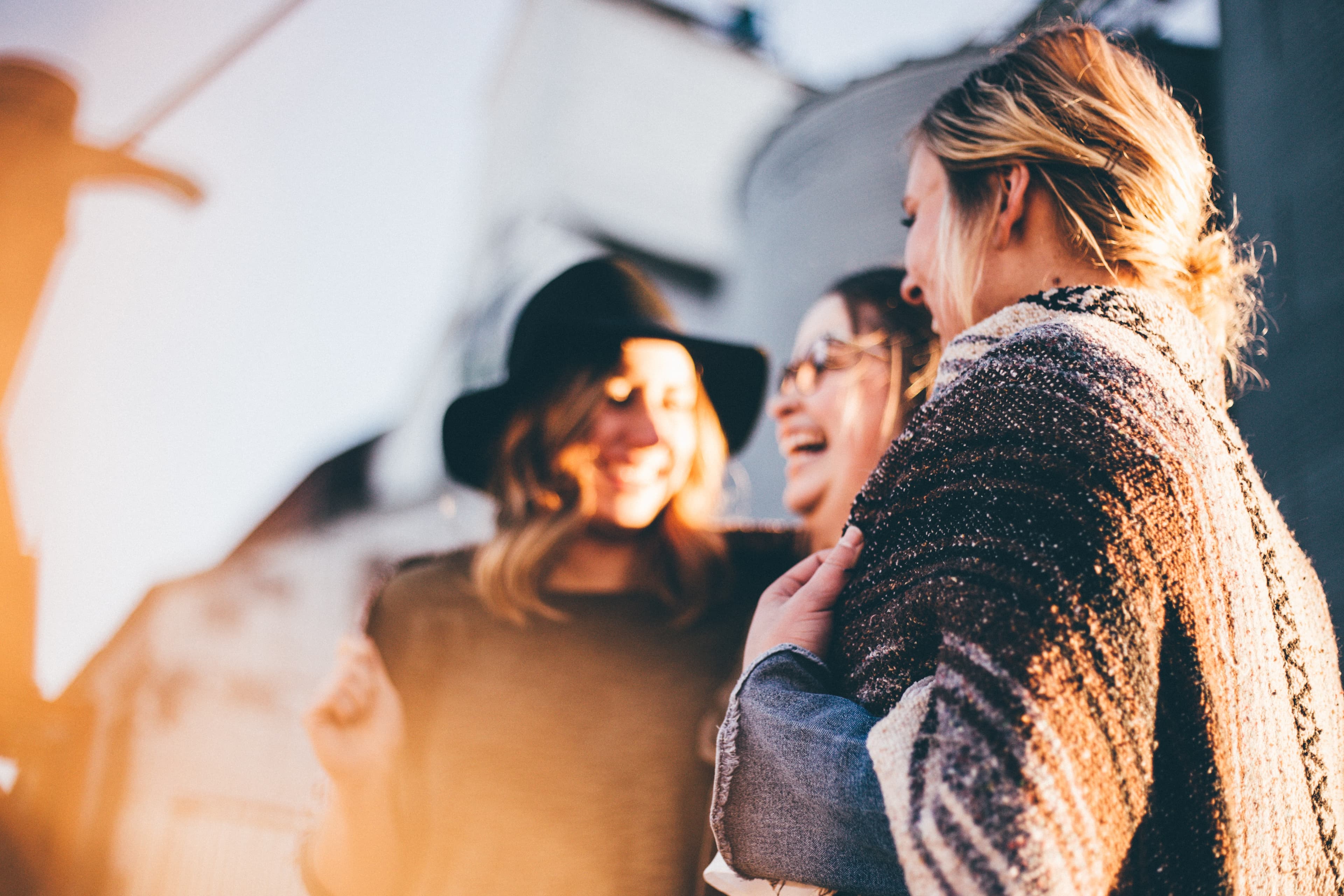 Adults laughing at dusk