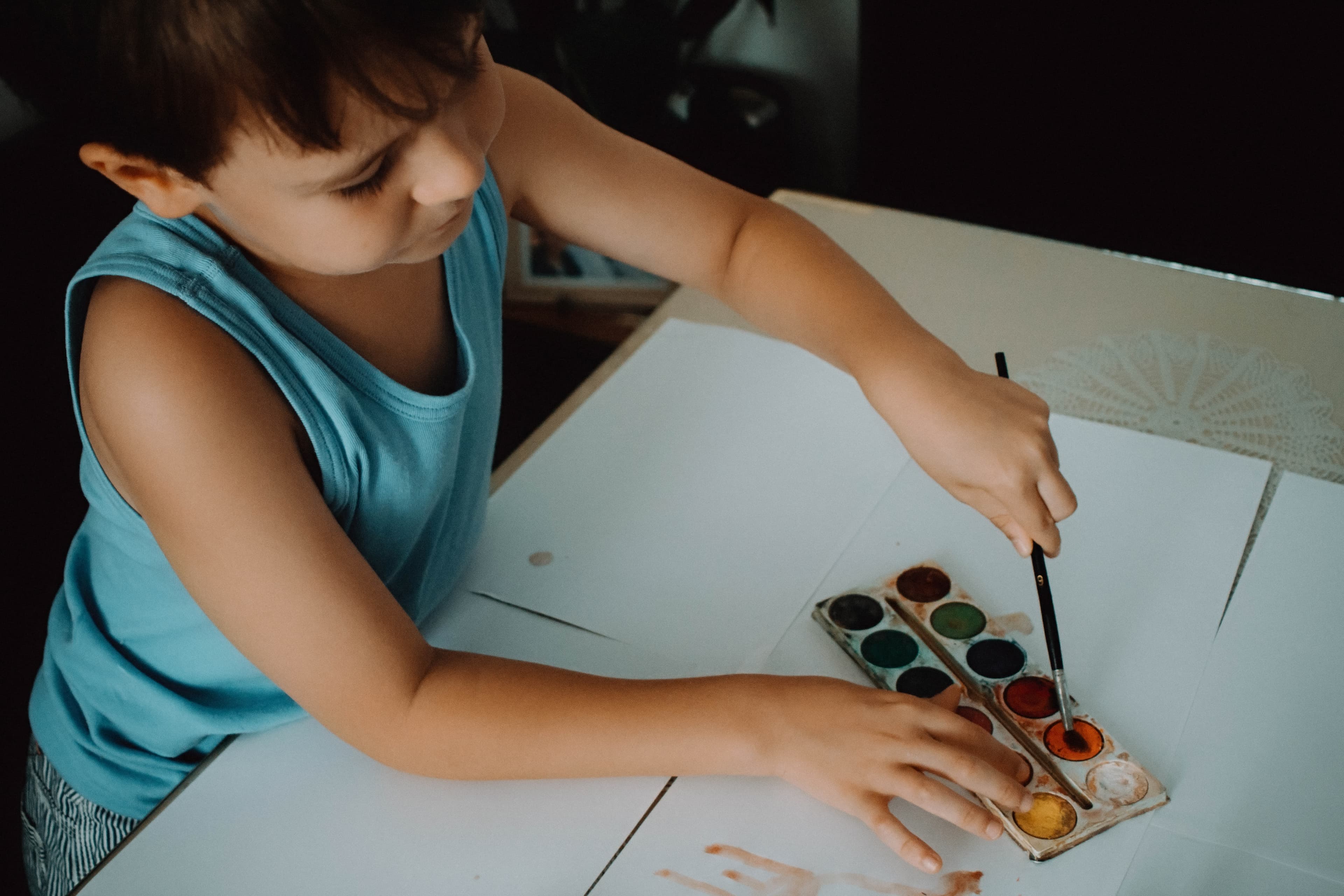 A child painting on a paper