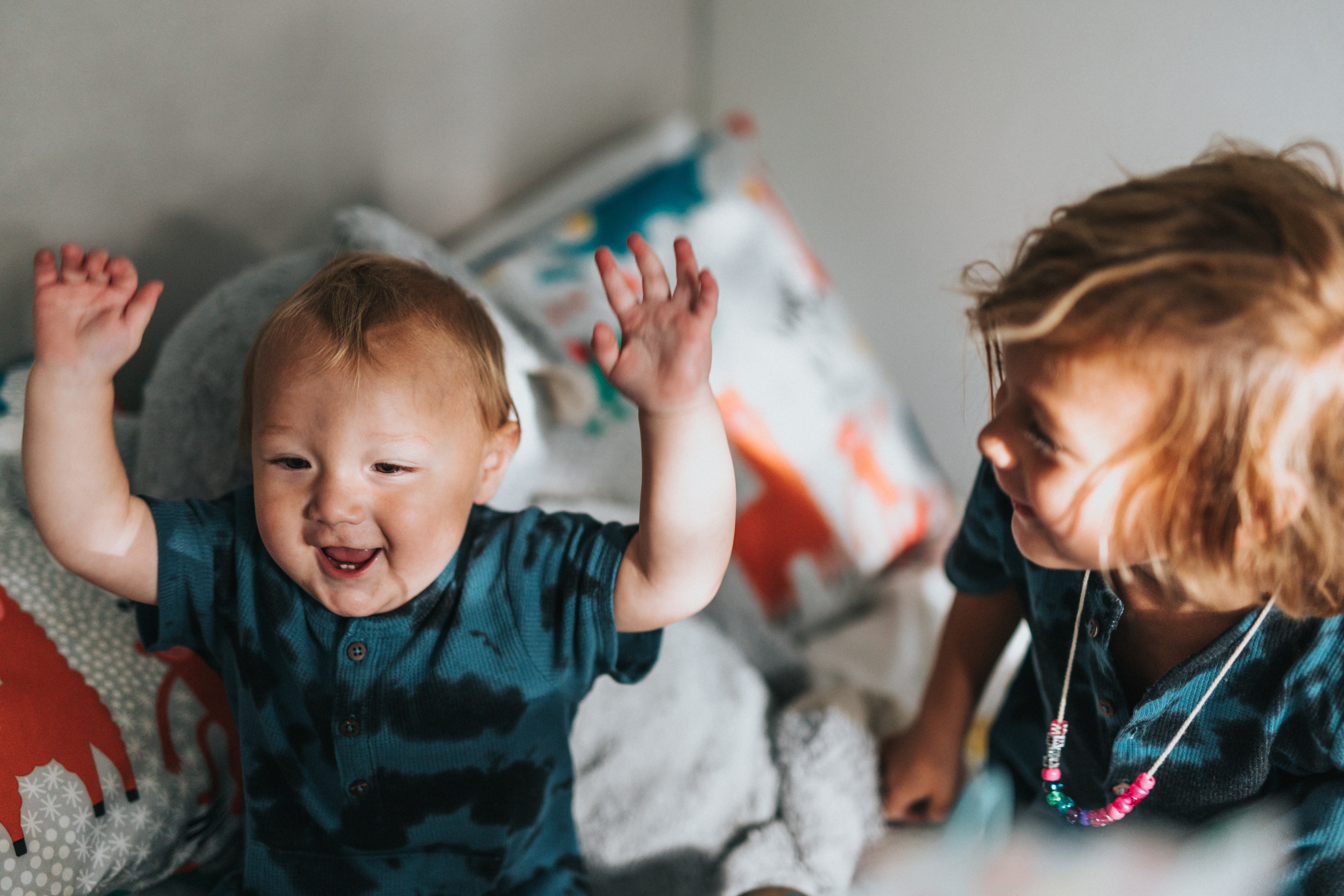 Two children of different ages playing