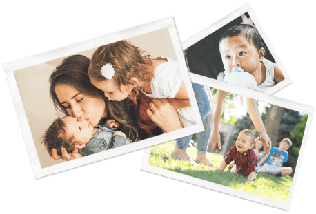 Photos scattered, facing up, depicting various photos of young kids and nannies
